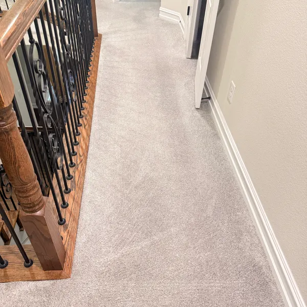 Freshly cleaned upstairs landing and hallway carpet in a north Fort Worth rental home