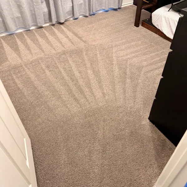 Bedroom carpet cleaned before first guests in a Justin home