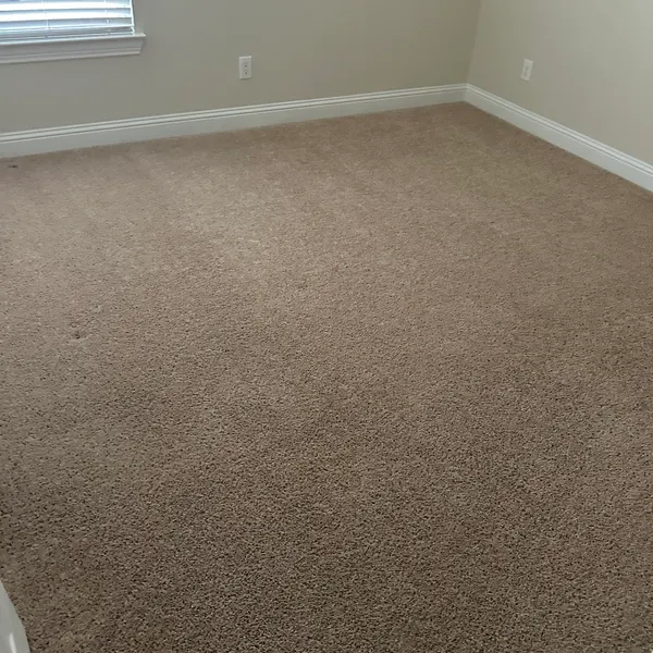 Freshly cleaned bedroom carpet in a rental home in The Highlands at Trophy Club before move-in