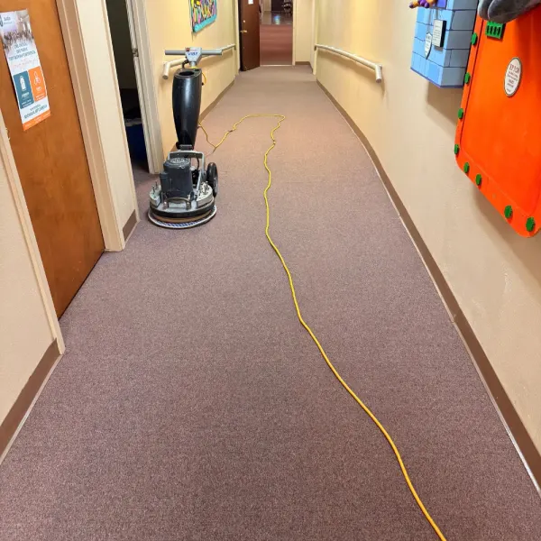 Church hallway carpet being cleaned with a commercial machine