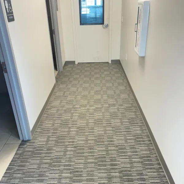 Office hallway carpet tiles after cleaning