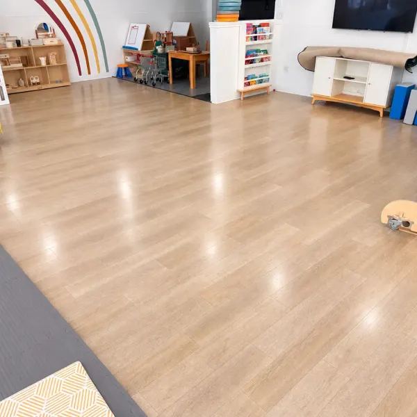 Daycare play room with shiny, clean vinyl plank floors after commercial floor cleaning in Southlake