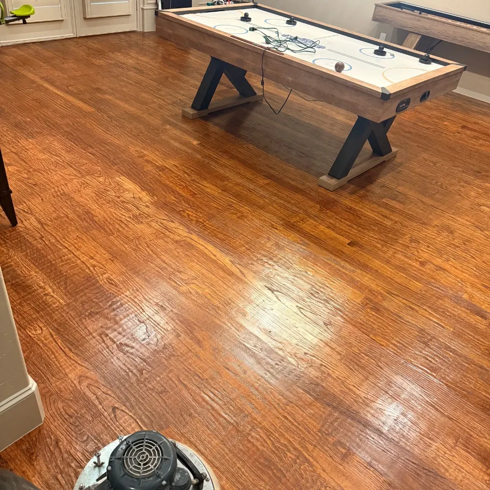 Game room hardwood floor after cleaning and buffing