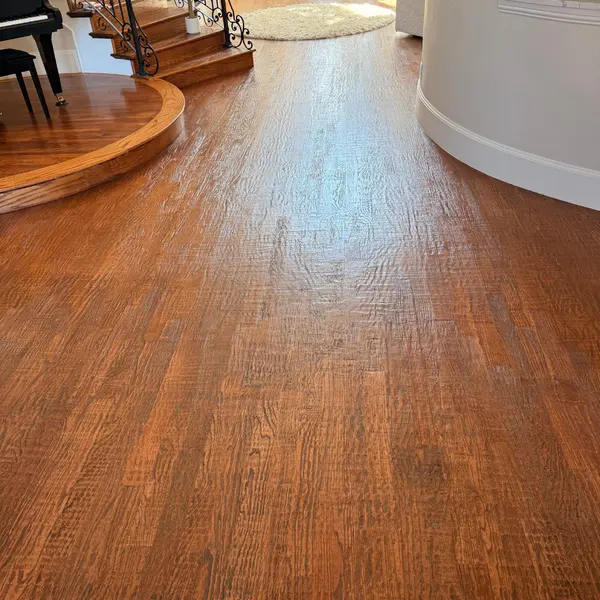 Hand-scraped hardwood floor and raised round platform after cleaning in a Southlake home