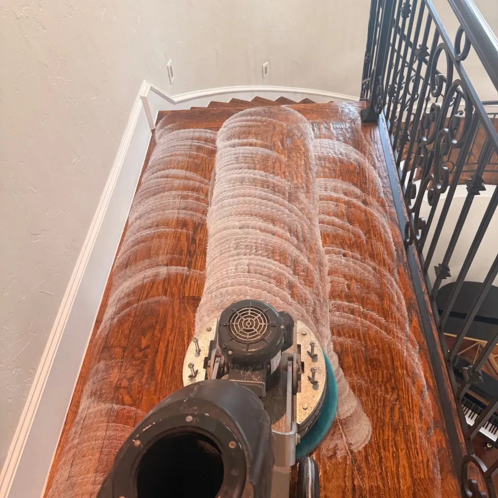 Hardwood stair landing after cleaning and buffing
