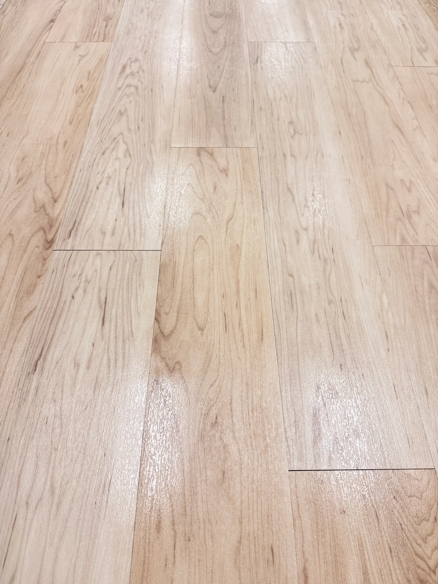 After daycare floor cleaning in Southlake: clean vinyl plank with the wood grain showing again