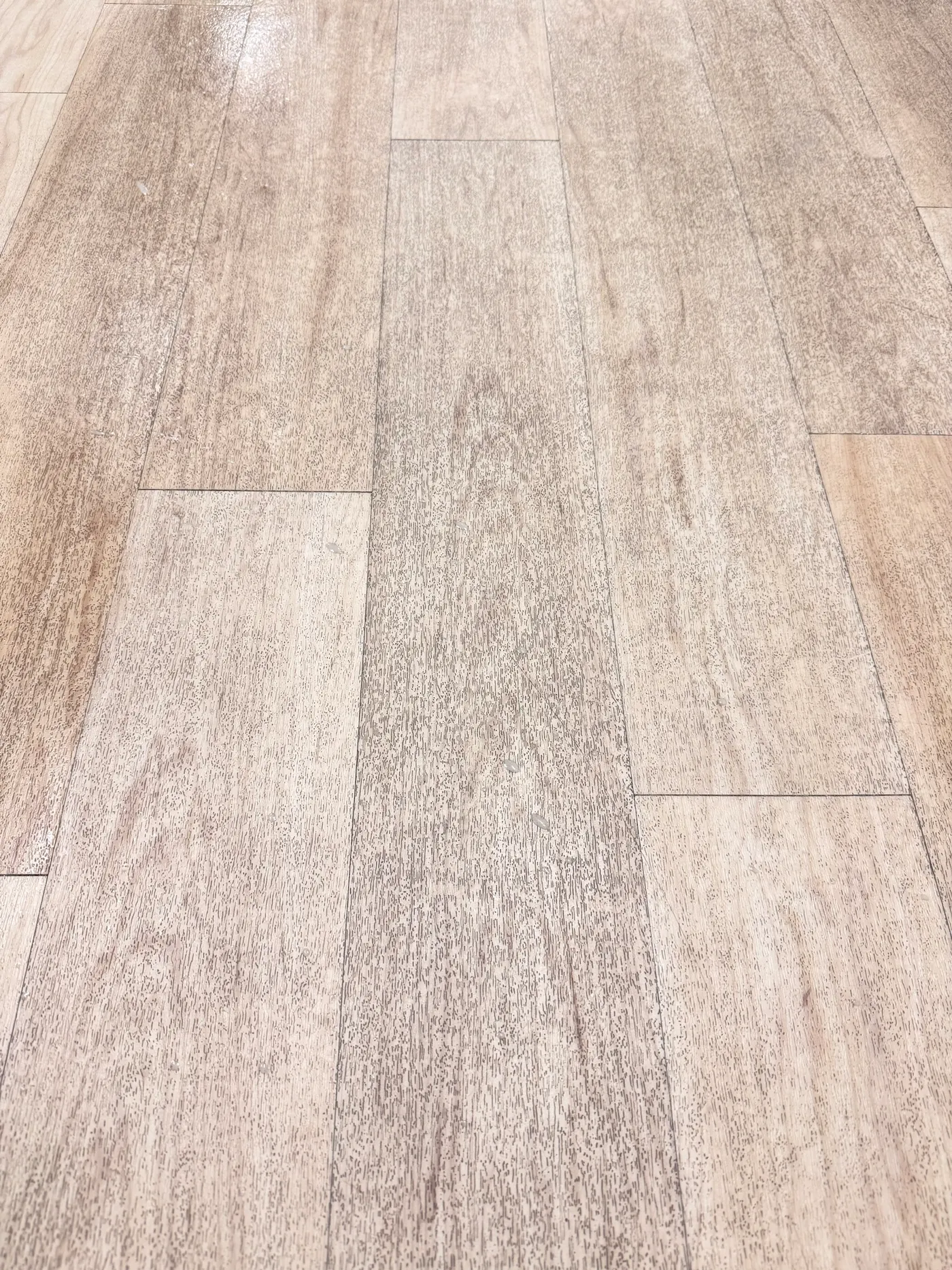 Before daycare floor cleaning in Southlake: gray grime packed into textured vinyl plank