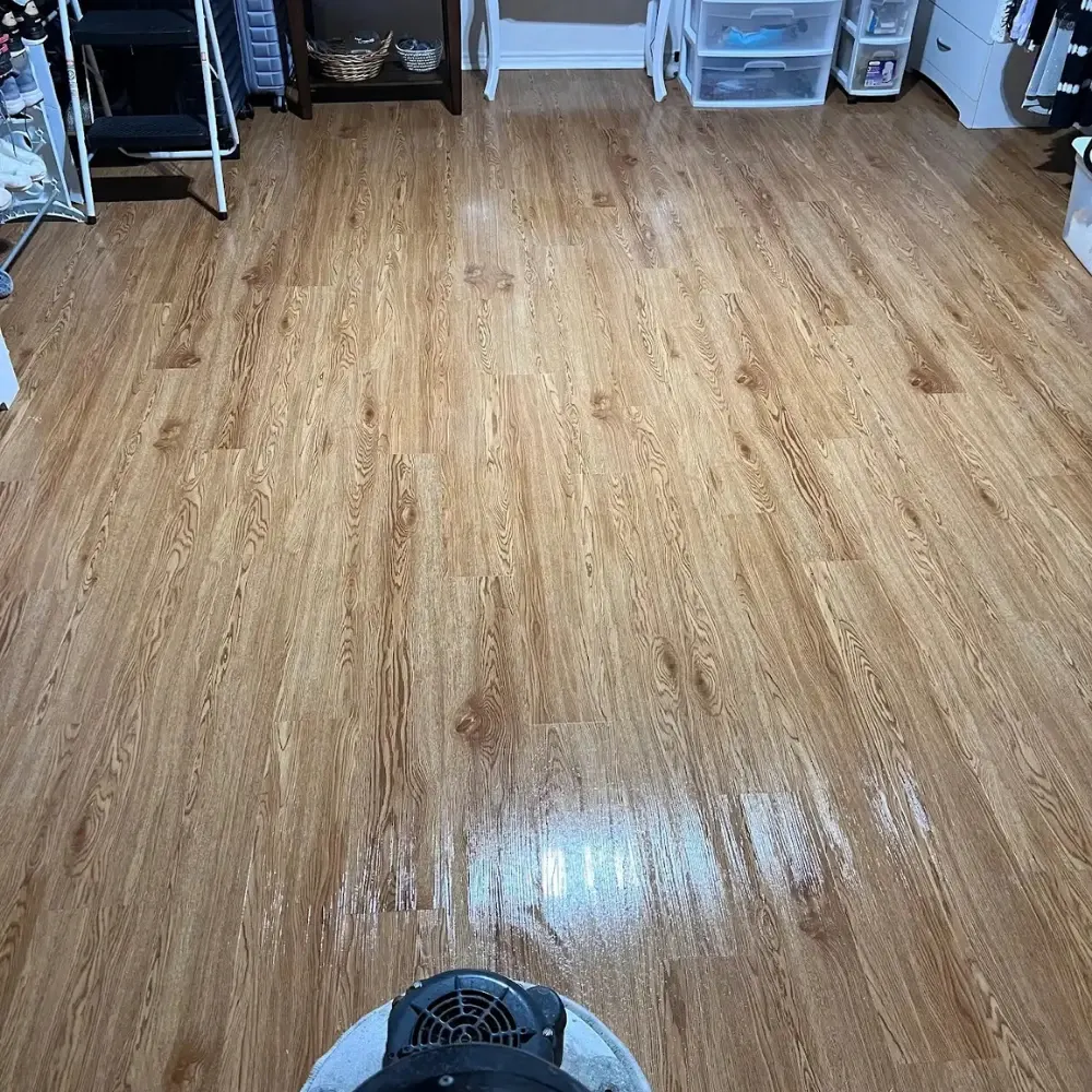 Luxury vinyl plank floor with a fresh shine after cleaning and buffing