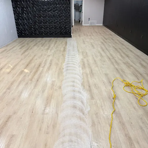 Luxury vinyl plank floor being scrubbed in a Southlake salon