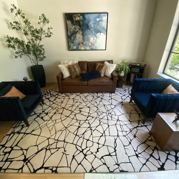 Black-and-white area rug after cleaning in a Southlake living room