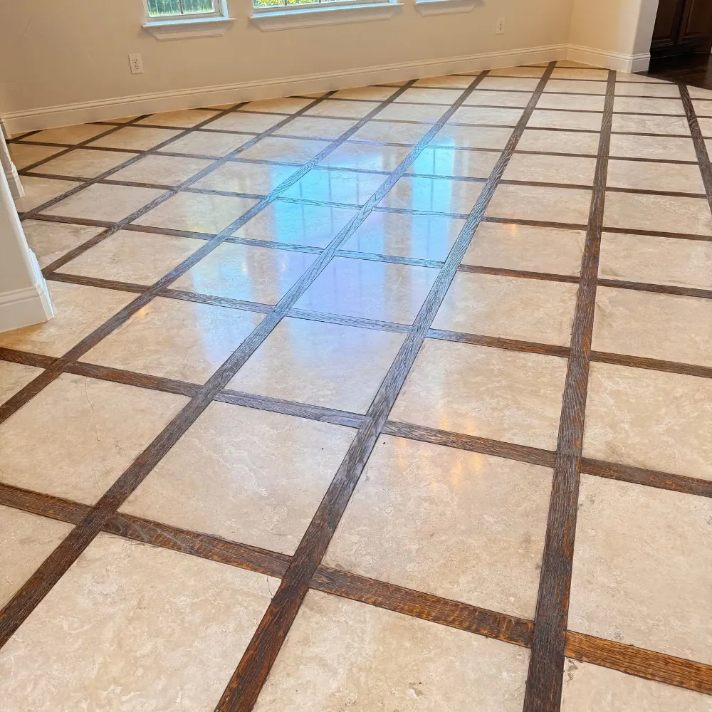 Travertine floor with a decorative inlay after cleaning