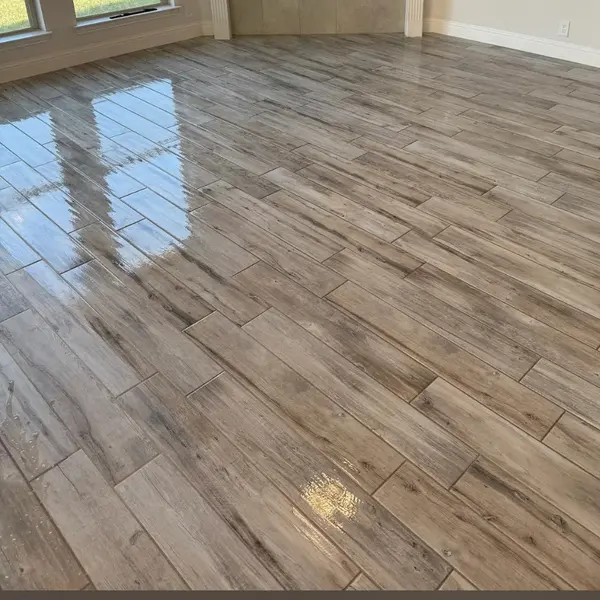 Wood-look tile floor after tile and grout cleaning in an Argyle home