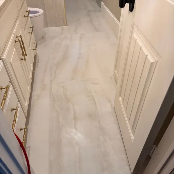 Guest bathroom tile floor after tile and grout cleaning in Lantana