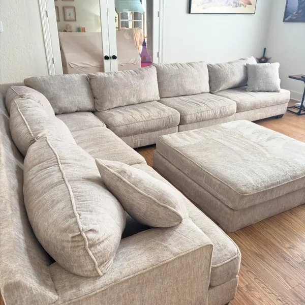 Fabric sectional and ottoman after upholstery cleaning in a Flower Mound home