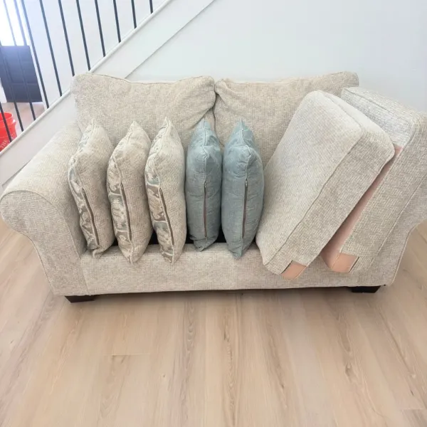 Loveseat and throw pillows after upholstery cleaning