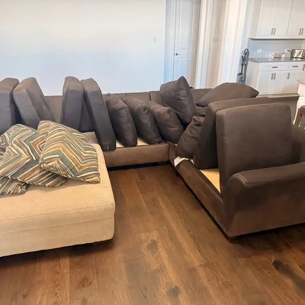 Sofa and loveseat with cushions set out during upholstery cleaning in North Richland Hills