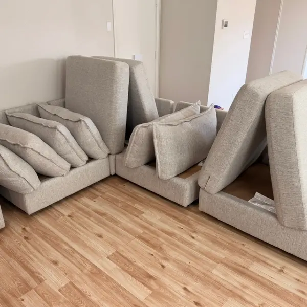 Sectional with removable cushions lifted for upholstery cleaning in Roanoke